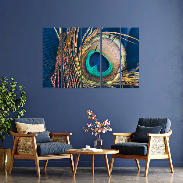 Living room with a peacock feather painting on a blue wall, two chairs, and a coffee table.