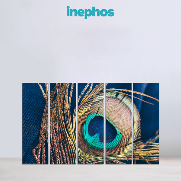 Peacock feather with vibrant colors on a blue background, featuring the brand 'inephos'.