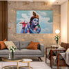Living room with a large wall art of a deity playing a flute.