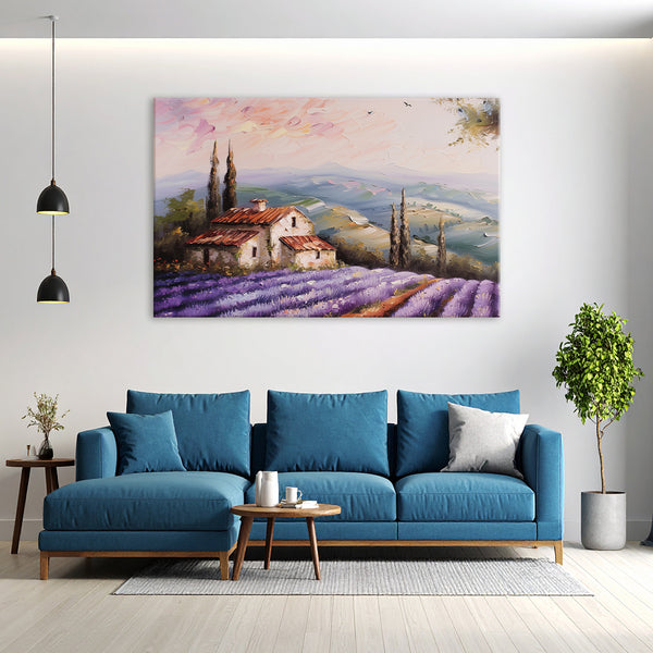 Modern living room with a blue sofa, coffee table, and wall art of a lavender field.
