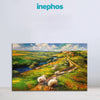 Painting of sheep in a pastoral landscape with 'inephos' branding.