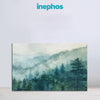 Framed artwork of a forest landscape with 'inephos' branding above.