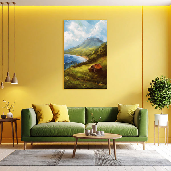 Living room with a green sofa, coffee table, and wall art of a mountain landscape.
