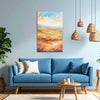 Living room with a blue sofa, colorful painting, and hanging lamps.