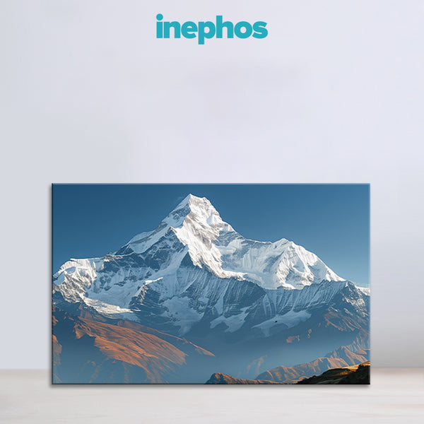 Framed photograph of a snow-capped mountain with 'inephos' branding above.
