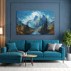 Blue sofa in a living room with a mountain painting on the wall.