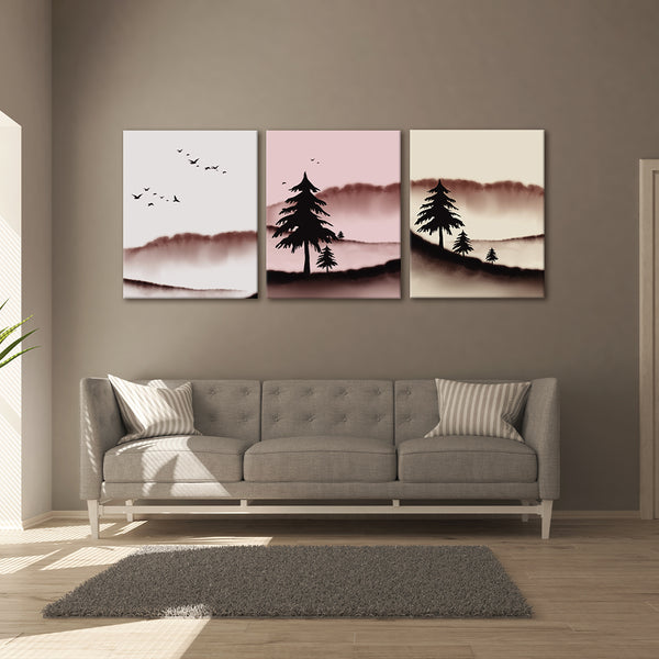 Three landscape paintings above a gray sofa in a living room.