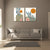 Gray sofa in a living room with two abstract art pieces on the wall.