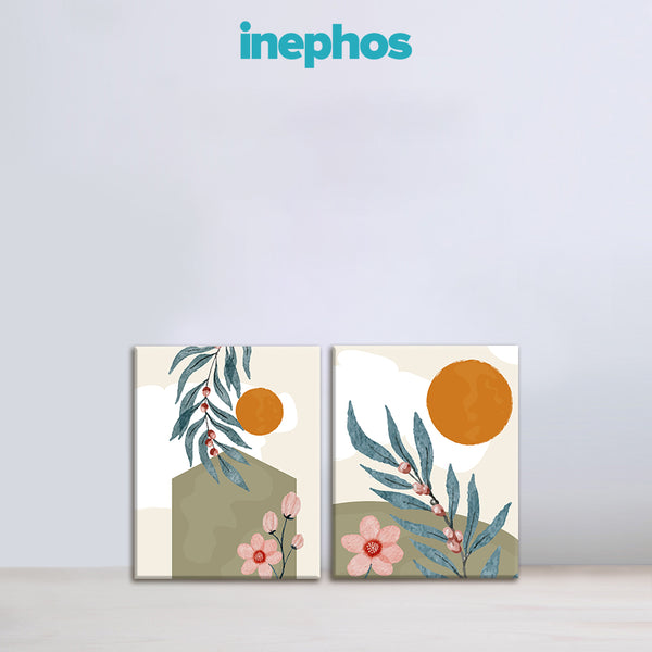 Two abstract art prints with floral elements and orange circles on a light gray background, featuring the brand 'inephos'.