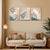 Living room with a beige sofa, decorative pillows, and wall art featuring abstract leaf designs.