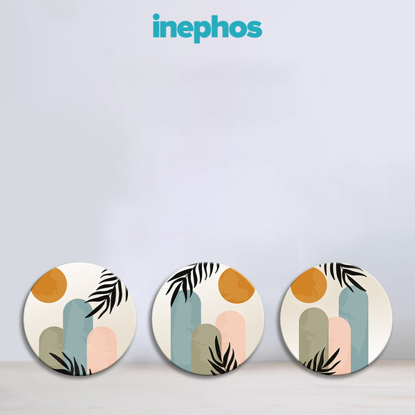 Three circular coasters with abstract designs on a light gray background, featuring the brand 'inephos'.
