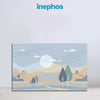 Framed landscape artwork with trees and mountains on a light blue background, featuring the brand 'inephos'.