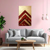 Living room with gray sofa, wooden coffee table, and abstract red and gold painting on pink wall.