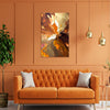 Orange living room with a tufted sofa, abstract painting, and decorative elements.