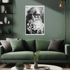 Living room with a green sofa, decorative pillows, and a wall poster of an elderly man with text.