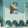 Abstract cityscape painting on a teal wall above blue chairs.
