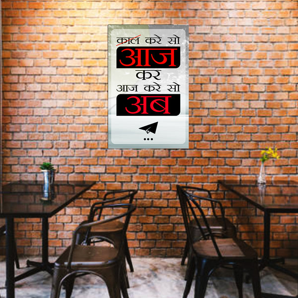 Restaurant interior with tables, chairs, and a decorative sign on a brick wall.