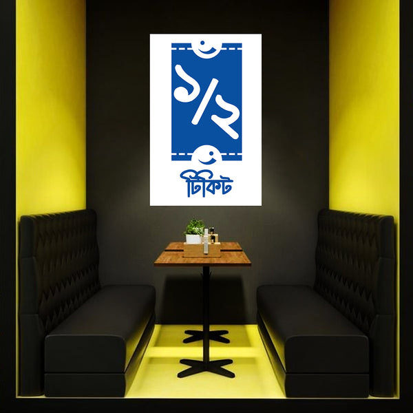 Modern interior with black booths, a wooden table, and a blue and white poster on a dark wall.