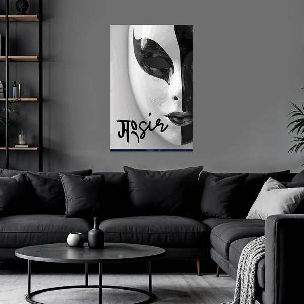 Abstract art piece on a wall above a black sofa in a living room.