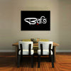 Dining area with a table and chairs, and a black wall art piece with white text on a gray wall.