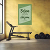 Motivational poster on a yellow wall with gym equipment below