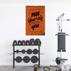 Gym equipment with motivational poster on a white wall