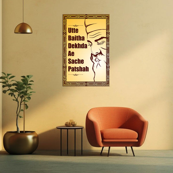 Decorative wall art with text and a face design in a living room setting.