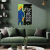 Living room with a green sofa and decorative wall art featuring a stylized figure and text.