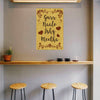 Decorative wall art with text and hearts on a beige background in a room with stools and a shelf.