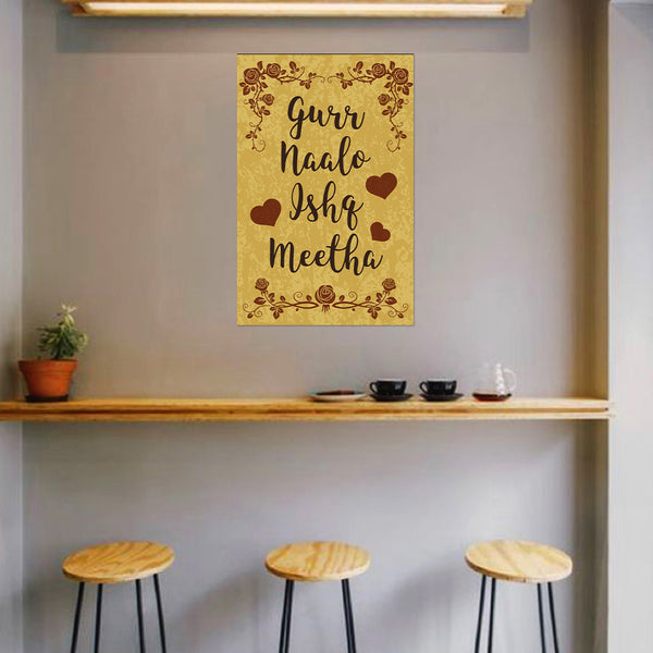 Decorative wall art with text and hearts on a beige background in a room with stools and a shelf.