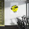 Gym interior with a poster on the wall featuring a graphic design.