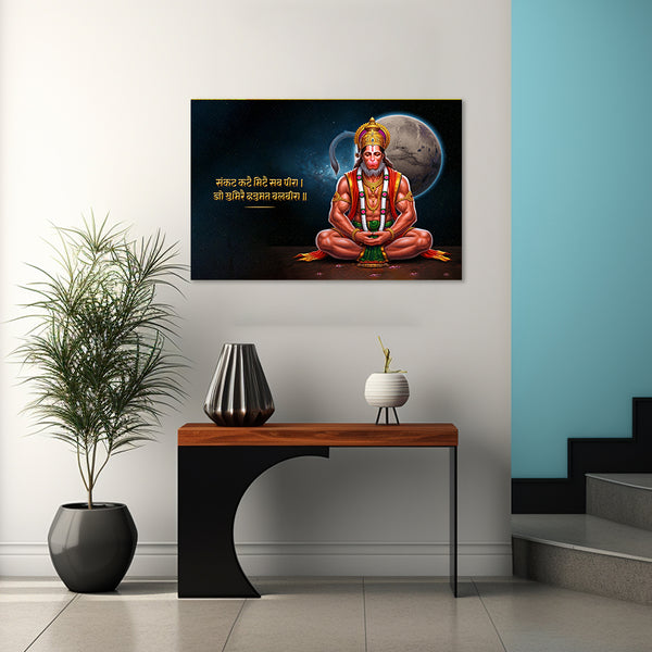 Decorative wall art of a seated figure with text on a wall above a table with decorative items.