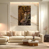 Modern living room with a beige sofa, coffee table, and decorative wall art.