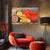 Decorative room with a red armchair, ottoman, and lamp, featuring a colorful Buddha painting on the wall.