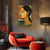 Modern living room with a red armchair, side table, and abstract painting on the wall.