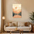 Lavender wall art above a beige sofa in a living room setting