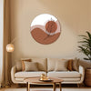 Living room with a beige sofa, decorative pillows, a round coffee table, and a wall art piece.