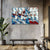 Abstract stained glass-style artwork on a wall with a bench and plant in the foreground.