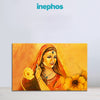 Painting of a woman in an orange saree with flowers, branded 'inephos'.