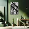 Living room with green walls, a black and white architectural print, and decorative vases.