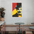 Colorful portrait of a famous figure on a white brick wall above a cafe setting.