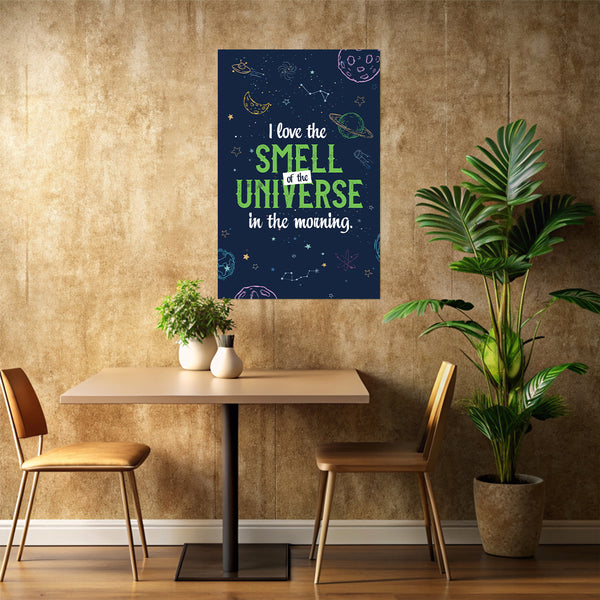Poster with space-themed text on a wall above a table with chairs and plants.