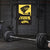 Barbell with weights in a gym setting featuring a security camera sign.