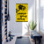 Gym room with exercise equipment and a yellow warning sign on the wall.
