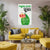 Living room with a yellow sofa, plants, and a poster on the wall.