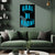 Living room with a green sofa and a decorative poster on the wall.